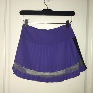 Purple and black tennis pleated skirt.